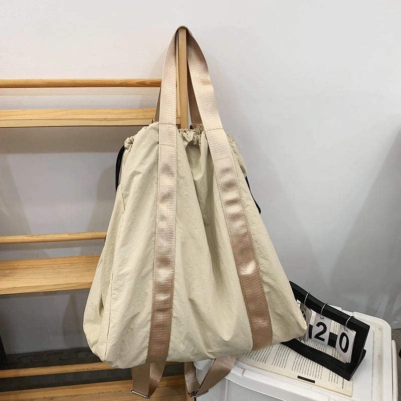 Solid color nylon fabric hand-held backpack