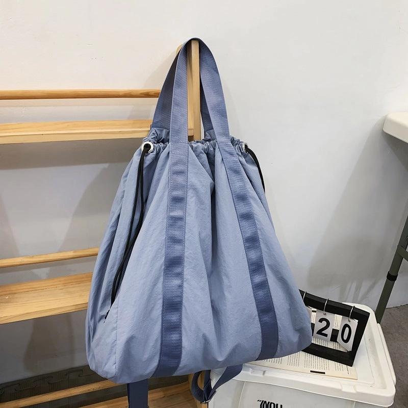 Solid color nylon fabric hand-held backpack