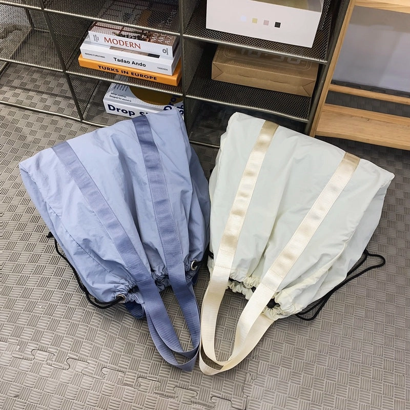 Solid color nylon fabric hand-held backpack