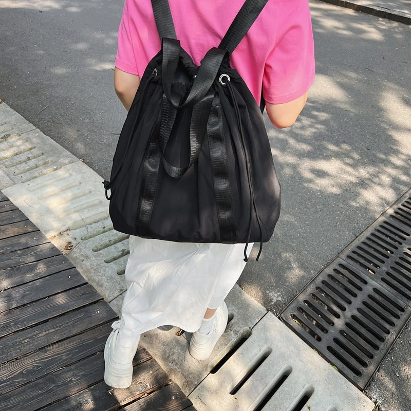 Solid color nylon fabric hand-held backpack