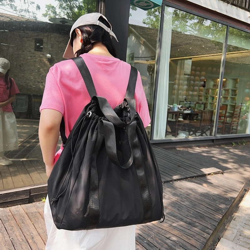 Solid color nylon fabric hand-held backpack